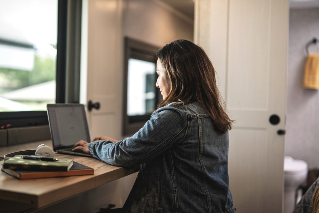 Image of woman reviewing her RV's care and coverage policy. 